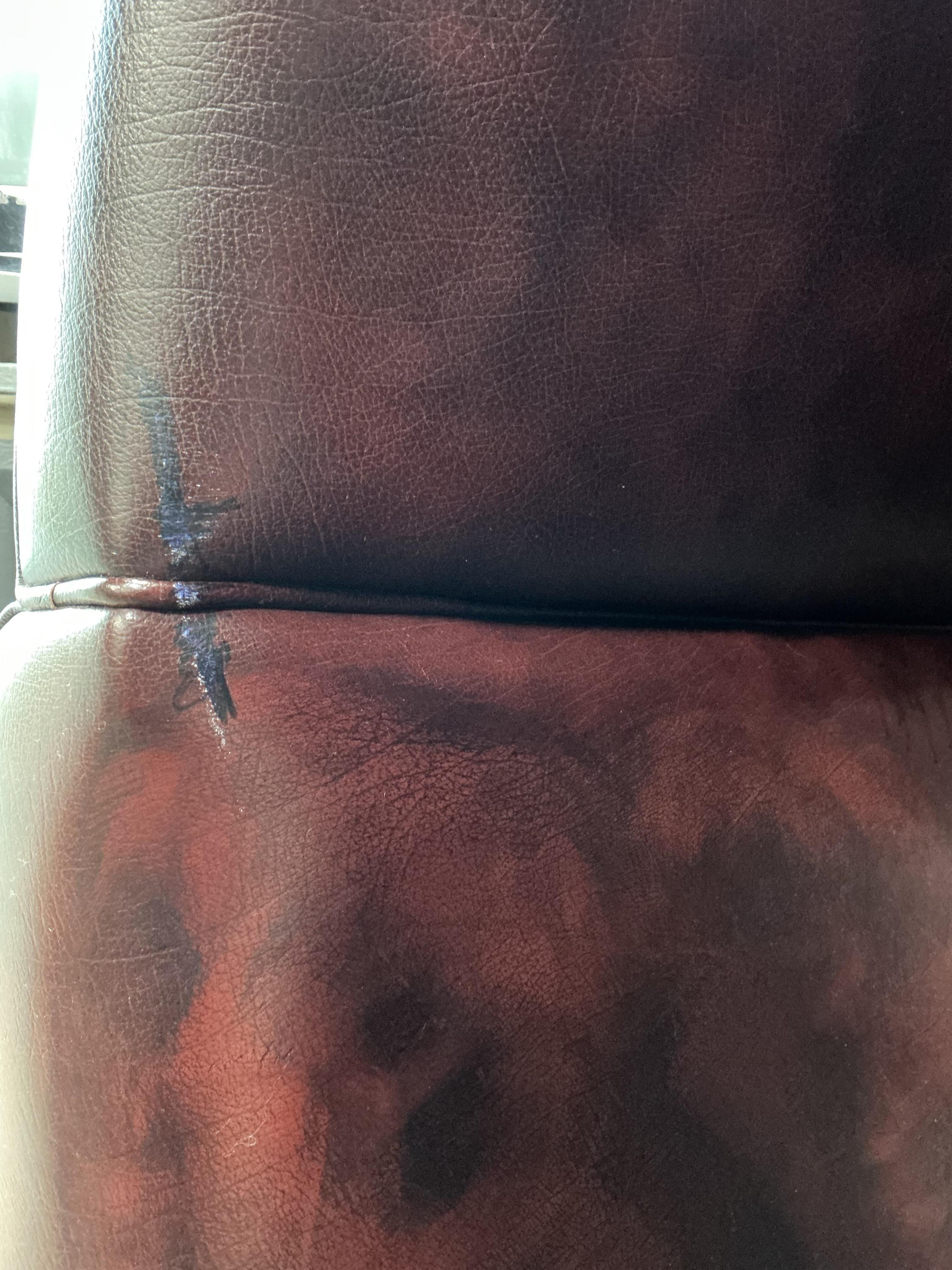 A reproduction buttoned burgundy leather hall porter's chair, width 88cm, depth 64cm, height 176cm